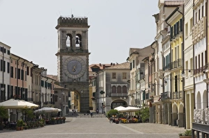 Street cafes and the Town Gate with ornamental clock tower, Este, Veneto, Italy, Europe