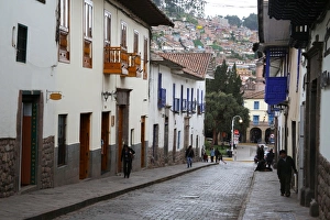 Side street in centre of Cusco City with outskirts of city on hill beyond, Cuzco Side street in centre of Cusco City with outskirts of city on hill beyond, Cuzco