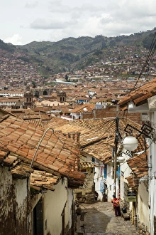 Street scene in San Blas neighbourhood with a view over the rooftops of Cuzco, UNESCO World Heritage Site, Peru, South America Street scene in San Blas neighbourhood with a view over the rooftops of Cuzco, UNESCO World Heritage Site, Peru, South America