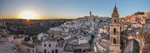 Places Of Worship Gallery: Sun rising over the canyon and Sassi di Matera old town with the campanile of the church of Saint Peter Barisano