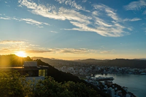 The sun sets over a new home atop Mount Victoria in Wellington, North Island, New Zealand The sun sets over a new home atop Mount Victoria in Wellington, North Island, New Zealand