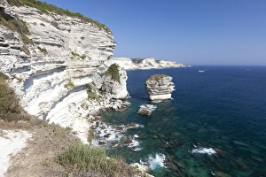Sun shines on the white limestone cliffs framed by the turquoise sea, Bonifacio, Corsica Sun shines on the white limestone cliffs framed by the turquoise sea, Bonifacio, Corsica