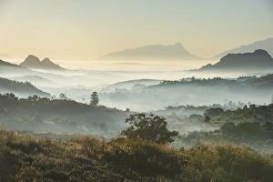 Sunrise and fog over the mountains surrounding Blantyre, Malawi, Africa Sunrise and fog over the mountains surrounding Blantyre, Malawi, Africa