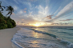 Maldives Gallery: Sunrise over the Indian Ocean from a deserted beach in the Northern Huvadhu Atoll, Maldives