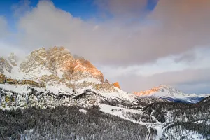 Sunrise over Monte Cristallo and Passo Tre Croci surrounded by snowy woods, Dolomites Sunrise over Monte Cristallo and Passo Tre Croci surrounded by snowy woods, Dolomites