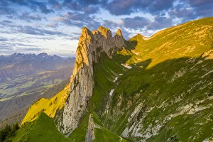 Sunrise on rocky peak of Saxer Lucke mountain in summer, Appenzell Canton, Alpstein Range Sunrise on rocky peak of Saxer Lucke mountain in summer, Appenzell Canton, Alpstein Range
