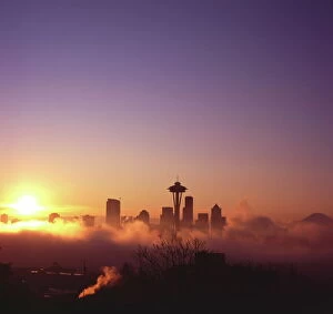 Sun Light Gallery: Sunrise over silhouette of Seattle skyline and Mt. Rainier, Seattle, Washington