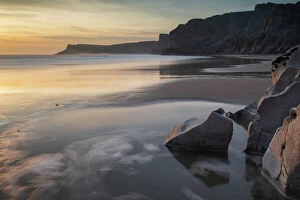 Welsh Culture Collection: Sunset over a deserted Mewslade Bay in Gower in winter, South Wales, United Kingdom