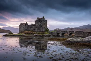 Sunset behind Eilean Donan Castle on Loch Duich in the Scottish Highlands, Scotland Sunset behind Eilean Donan Castle on Loch Duich in the Scottish Highlands, Scotland