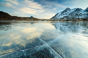 Sunset on the frozen Lej Nair surrounded by snowy peaks, Bernina Pass, Canton of Graubunden Sunset on the frozen Lej Nair surrounded by snowy peaks, Bernina Pass, Canton of Graubunden