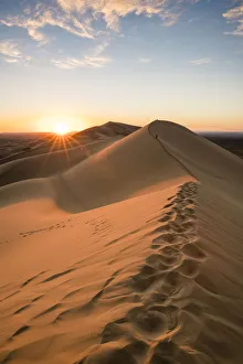 Sunset on Khongor sand dunes in Gobi Gurvan Saikhan National Park, Sevrei district Sunset on Khongor sand dunes in Gobi Gurvan Saikhan National Park, Sevrei district