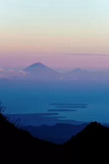 Sunset over Mount Agung and Mount Batur on Bali, and the Three Gili Isles taken from Mount Rinjani, Lombok, Indonesia