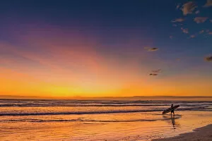 Sunset & surfer at Playa Guiones beach, Nosara, Nicoya Peninsula, Guanacaste Province, Costa Rica, Central America