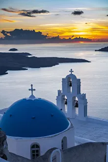 Sunset over the volcanic island of Santorini and Anastasi Orthodox Church at sunset, Fira Sunset over the volcanic island of Santorini and Anastasi Orthodox Church at sunset, Fira