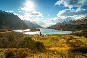 Sunshine and The Glenfinnan Monument beside Loch Shiel, Highlands, Scotland Sunshine and The Glenfinnan Monument beside Loch Shiel, Highlands, Scotland