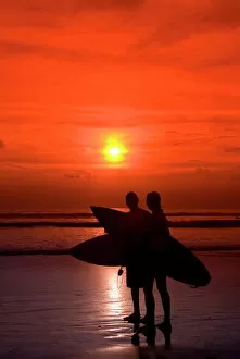 Indonesian Gallery: Two surfers calling it a day, Kuta Beach, Bali, Indonesia, Southeast Asia, Asia
