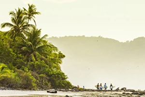 Surfers strolling on the beach at this hip southern Nicoya Peninsula surf resort Surfers strolling on the beach at this hip southern Nicoya Peninsula surf resort
