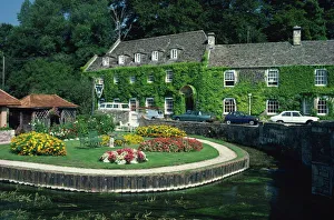 Swan Hotel on a bend in the River Coln, Bibury, Gloucestershire, The Cotswolds Swan Hotel on a bend in the River Coln, Bibury, Gloucestershire, The Cotswolds