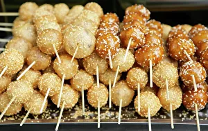 Sweet snacks sold by vendors in the city parks of Sichuan Province come in colorful shapes Sweet snacks sold by vendors in the city parks of Sichuan Province come in colorful shapes