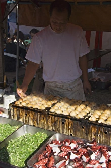 Takoyaki octopus balls being made at monthly flea market Takoyaki octopus balls being made at monthly flea market