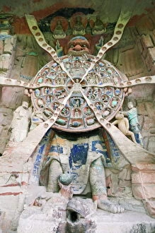 Buddhist Gallery: Tibetan Buddhist wheel of life rock sculpture at Dazu Rock Carvings, UNESCO World Heritage Site