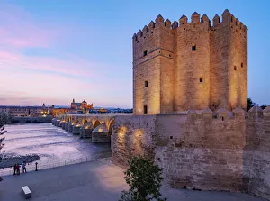 Torre de la Calahorra (Calahorra Tower) on the Roman Bridge at dusk Torre de la Calahorra (Calahorra Tower) on the Roman Bridge at dusk
