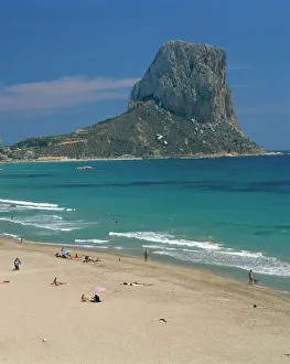 Tourists on the beach at Calpe and the Penon de Ifach Tourists on the beach at Calpe and the Penon de Ifach