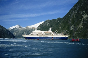 Inflatable Gallery: Tourists in an inflatable boat and cruise ship in the Chilean fjords, Chile