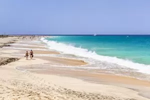 Santa Maria Collection: Tourists walking along the sandy beach, Ponta Preta beach, Santa Maria, Sal Island