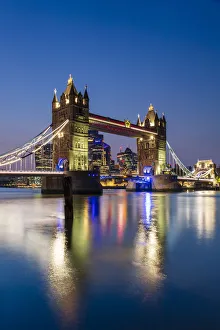 Tower Bridge and The City of London skyscrapers reflecting in River Thames at sunset, London, England, United Kingdom Tower Bridge and The City of London skyscrapers reflecting in River Thames at sunset, London, England, United Kingdom