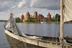 Prints of Traditional boat and Trakai Castle, Trakai, near Vilnius, Lithuania, Baltic States, Europe Lithuania Prints: Traditional Boat Print near Trakai Castle, Lithuania