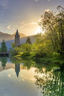 Traditional church of Sils facing Inn River at sunrise, Sils Maria, Engadine valley Traditional church of Sils facing Inn River at sunrise, Sils Maria, Engadine valley