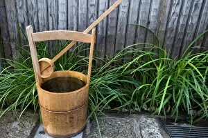 Images Dated 9th May 2009: Traditional Japanese wooden bucket and ladle for washing sidewalk in a custom called uchimizu