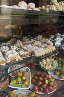 Traditional marzipan fruits and pastries in shop window