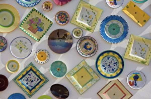 Variations Gallery: Traditional Portuguese pottery at artisan workshop with plates on wall, Cape St