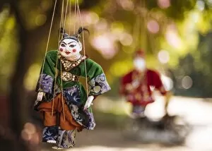 Stereotypically Asian Gallery: Traditional puppets hanging from tree, Bagan (Pagan), Mandalay Region, Myanmar (Burma)