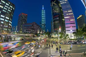 Traffic in front of Taipei 101 at a busy downtown intersection in the Xinyi district Traffic in front of Taipei 101 at a busy downtown intersection in the Xinyi district