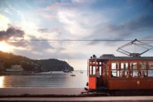Images Dated 7th December 2006: Tram at sunset set against yachts in bay, Soller, Mallorca, Balearic Islands