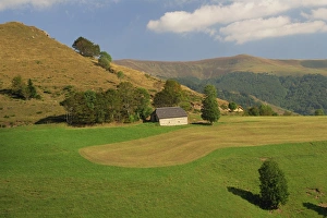 Tranquil scene in agricultural landscape of farmland and hills near Salers Tranquil scene in agricultural landscape of farmland and hills near Salers
