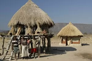 Lake Kariba Collection: Ttraditional thatch roofed house and grain storage, Lake Kariba, Zimbabwe, Africa
