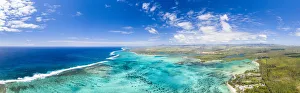 Turquoise coral reef meeting the waves of the Indian Ocean, aerial view, Poste Lafayette Turquoise coral reef meeting the waves of the Indian Ocean, aerial view, Poste Lafayette
