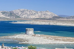 Turquoise sea and old tower surround La Pelosa Beach, Stintino, Asinara National Park Turquoise sea and old tower surround La Pelosa Beach, Stintino, Asinara National Park