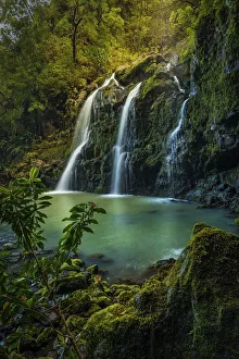 Upper Waikani Falls (Three Bears Falls) in soft sunset light catching early evening mist Upper Waikani Falls (Three Bears Falls) in soft sunset light catching early evening mist