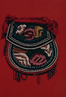 Velveteen and glass beads on pouch dating from 1850, of the Coughnawbga Mohawk of the Eastern Woodlands Velveteen and glass beads on pouch dating from 1850, of the Coughnawbga Mohawk of the Eastern Woodlands