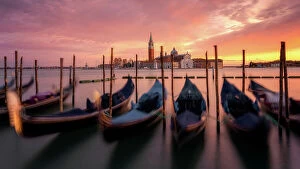 Places Of Worship Gallery: Venetian gondolas at sunset with the church of San Giorgio Maggiore in the background, Venice