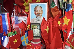 Vietnamese flags and portraits of Ho Chi Minh in a tourist shop Vietnamese flags and portraits of Ho Chi Minh in a tourist shop