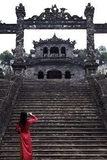 Camera Gallery: Vietnamese schoolgirl taking picture of Khai Dinhs Tomb, Hue, Vietnam
