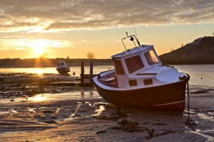 View towards the Aln Estuary during a stunning winter sunrise from the beach at low tide View towards the Aln Estuary during a stunning winter sunrise from the beach at low tide