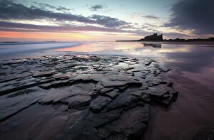 Northumberland Gallery: View towards Bamburgh Castle at sunrise from Bamburgh Beach, Bamburgh, Northumberland