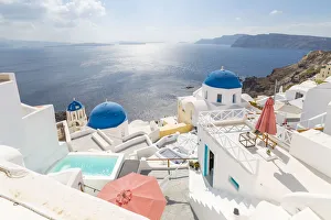 View of blue domed churches from cafe in Oia village, Santorini, Aegean Island, Cyclades Island View of blue domed churches from cafe in Oia village, Santorini, Aegean Island, Cyclades Island